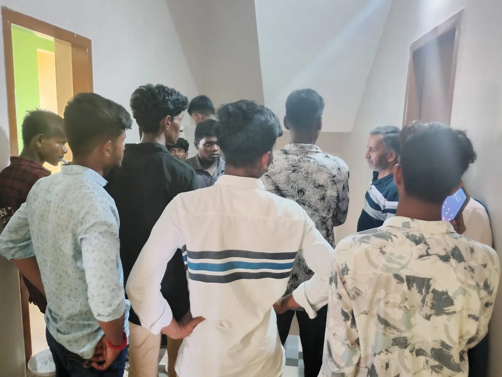 A group of members arriving at a Nia Studio in Sriperumbudur, gathered at the entrance with a manager during onboarding