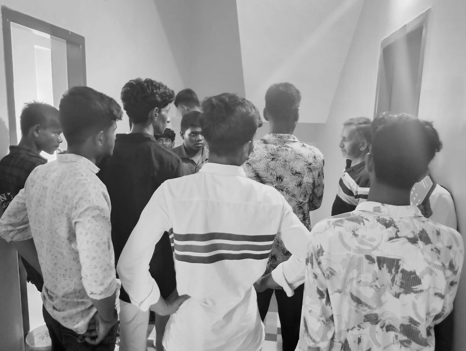 A group of members arriving at a Nia Studio in Sriperumbudur, gathered at the entrance with a manager during onboarding