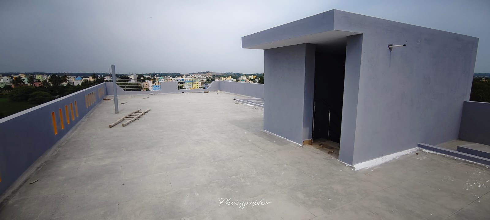 The rooftop terrace of a Nia residence in Hosur, overlooking the low-rise cityscape of the Bangalore–Hosur corridor
