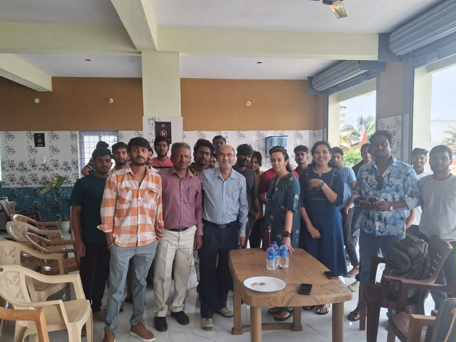 Nia members and facilitators together at the close of a financial literacy program in a Studio common area