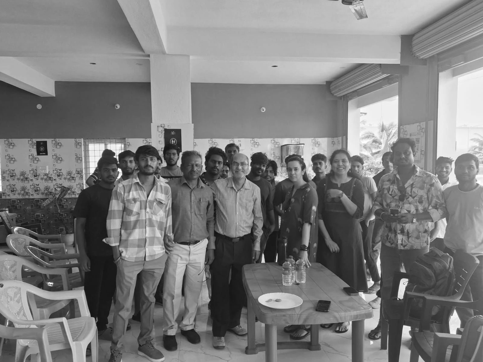 Nia members and facilitators together at the close of a financial literacy program in a Studio common area