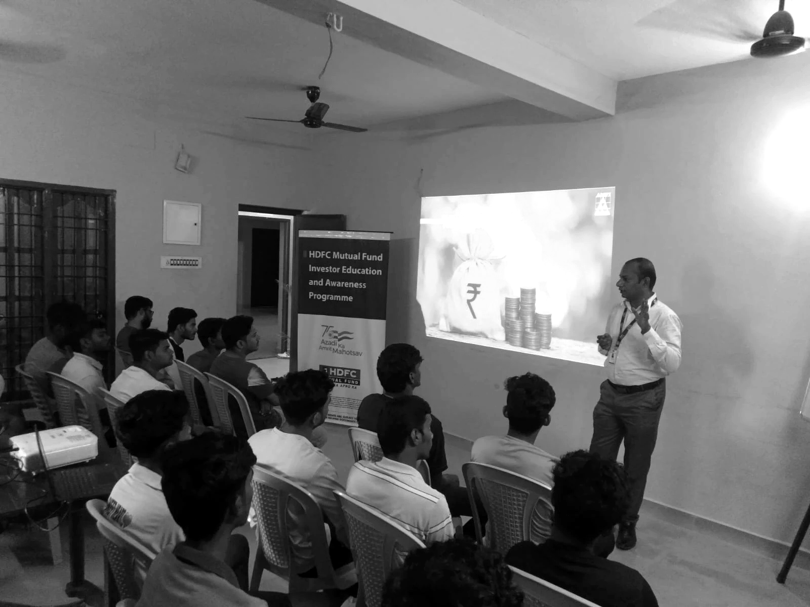 Nia members attending a financial literacy and investor awareness session in a residence common room